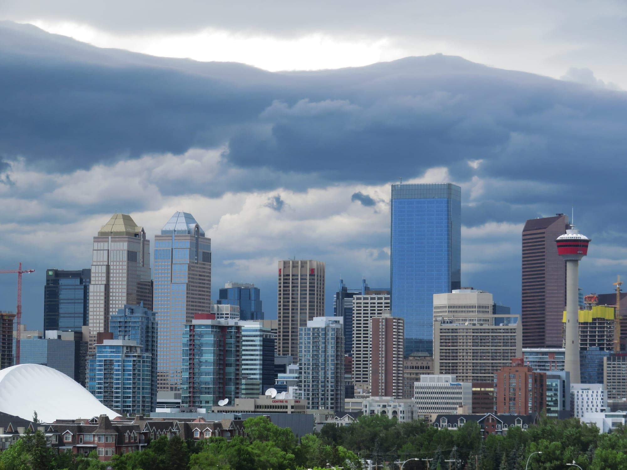 Storm cloud breaking over the downtown Calgary skyline